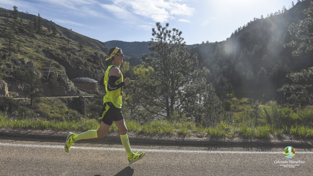 Young man running in the Poudre Canyon