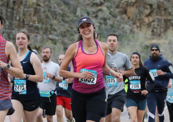 Smiling female runner in the half-marathon in Fort Collins