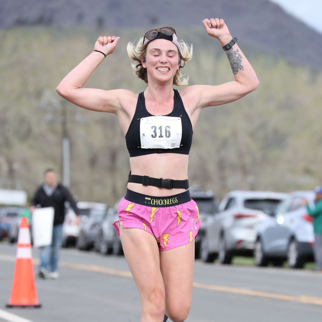 Happy female runner at the Colorado Marathon in Fort Collins 