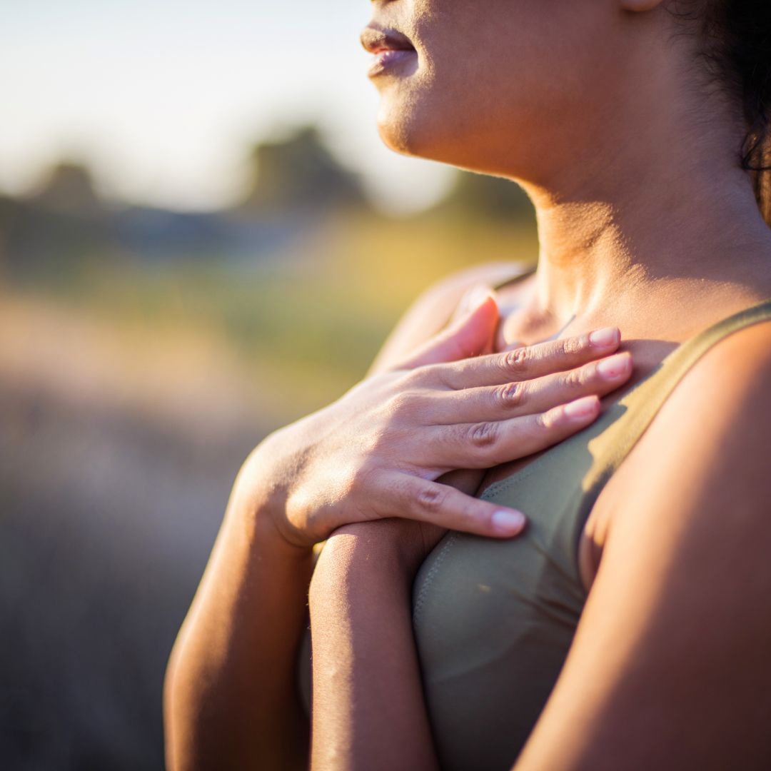 Woman practicing breathing tips for runners