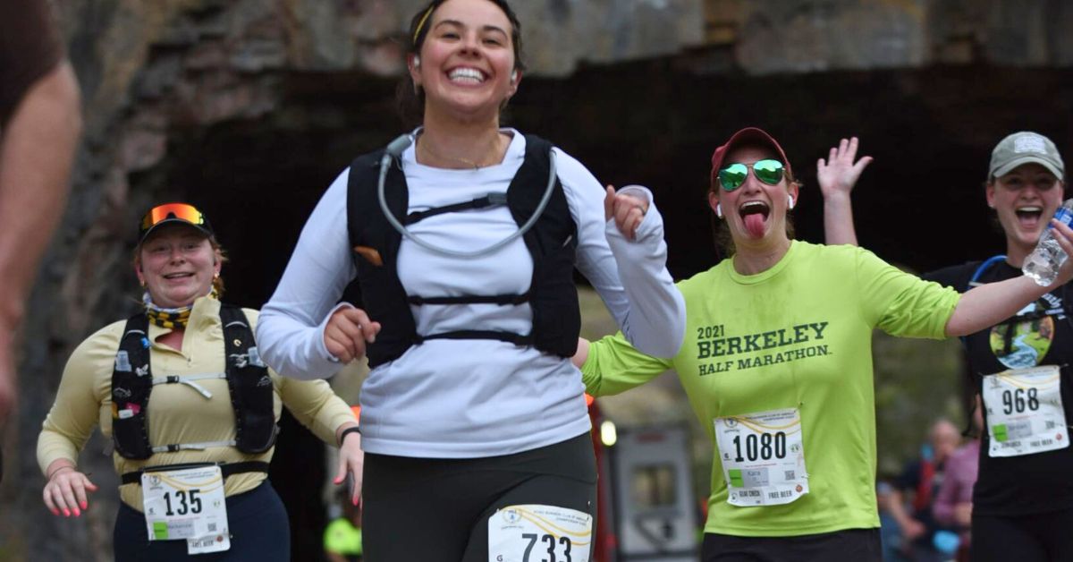 Happy runners staying hydrated to prevent altitude sickness and fuel their run