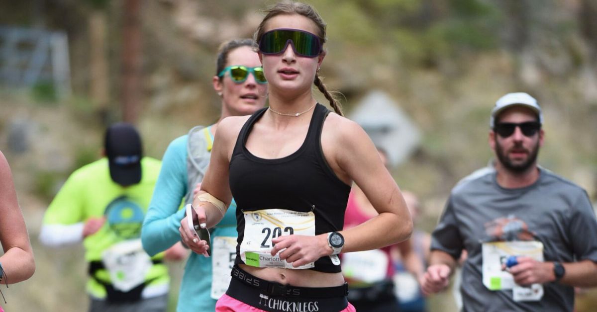 A group of runners in the Poudre Canyon running at high altitude at the Colorado Marathon